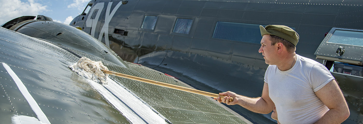 Suiting Up — C-53 Painted With D-Day Invasion Stripes