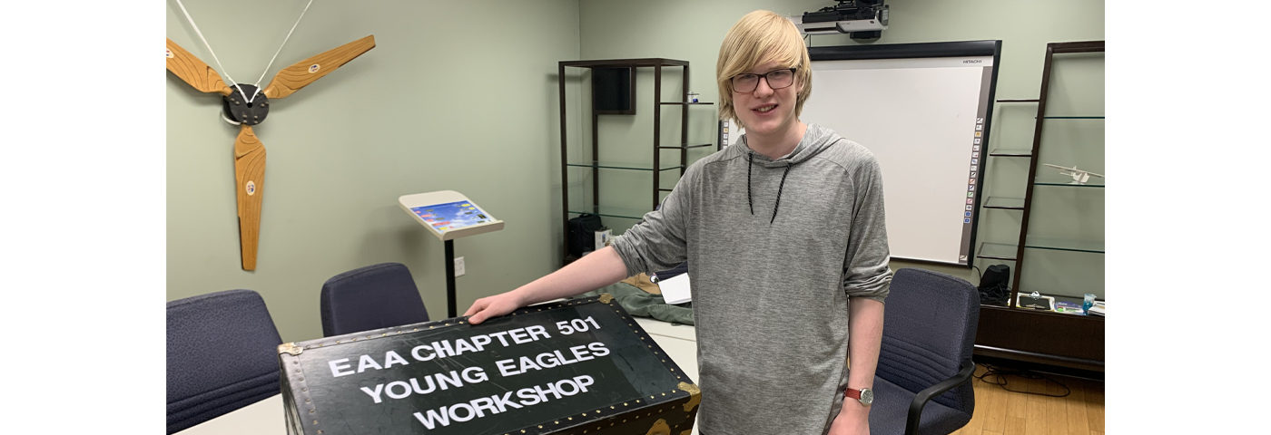 Ray Aviation Scholar Beck Youngberg Volunteers Lettering the Young Eagles Workshops Trunk