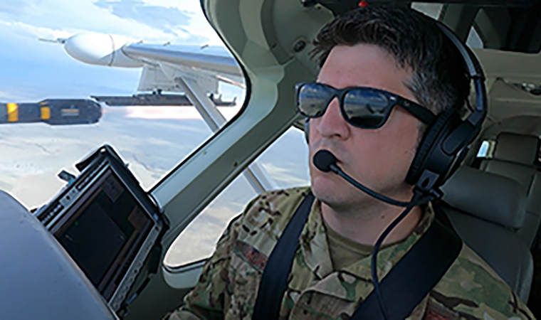 Air Force major Dan Jackson in the cockpit of a Cessna AC-208 Caravan.